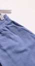 Blue pants with text embroidery on a white background