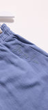 Blue pants with text embroidery on a white background