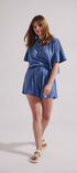 Woman wearing a blue outfit on a white background