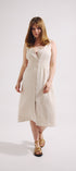 Woman wearing a white dress on a plain background