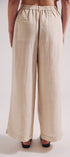 Beige wide-leg pants worn by a person on a white background