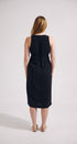 Woman wearing a black sleeveless dress on a white background