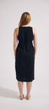 Woman wearing a black sleeveless dress on a white background