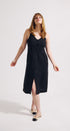 Woman wearing a black dress on a white background
