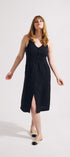 Woman wearing a black dress on a white background