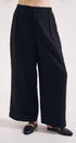 Black wide-leg pants worn by a person on a white background