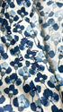 Fabric with blue floral pattern on a white background