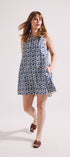 Woman wearing a patterned dress on a white background