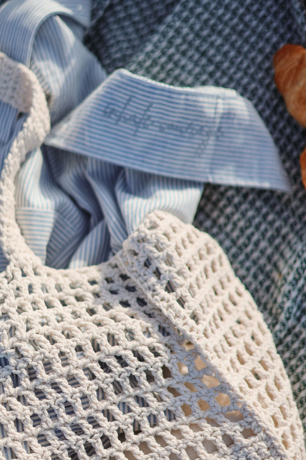 Textured fabric with a mesh bag and autumn leaves