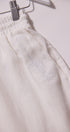 White sweatpants with text on a white background