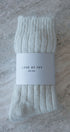 cream sock with 'Love of Ivy' label on a textured surface